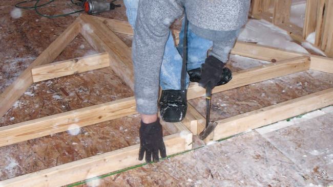 Standing Up the Walls: We butted the two wall frames together to keep them square.
