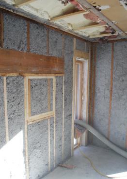 Spray-foam was used to seal the plates and boost R-values at the truss heels, and any open stud bays were filled with damp-spray cellulose.