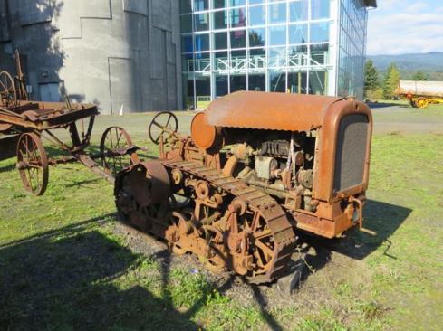 The tractor-style seat, stock radiator cover, and lack of protection over the operator suggest this machine was used for farming rather than logging.