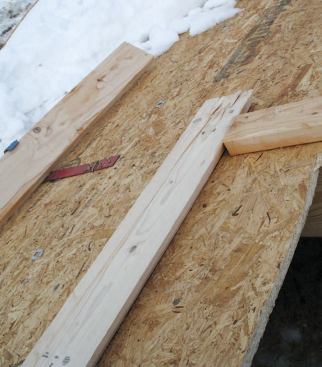 Countdown: Next we cut out the roof opening and placed some framing members around the edge to help us accurately position the dormer. We were ready for liftoff.