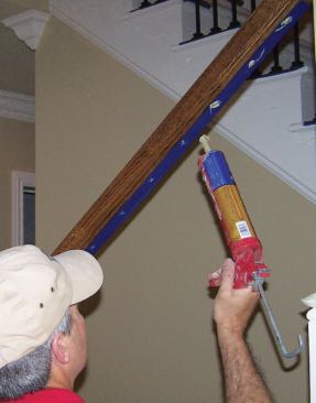The handrail's holes are injected with construction adhesive.