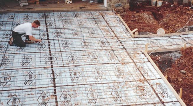 Next, sheets of wire mesh are laid out and the tubing is strapped to the grid.