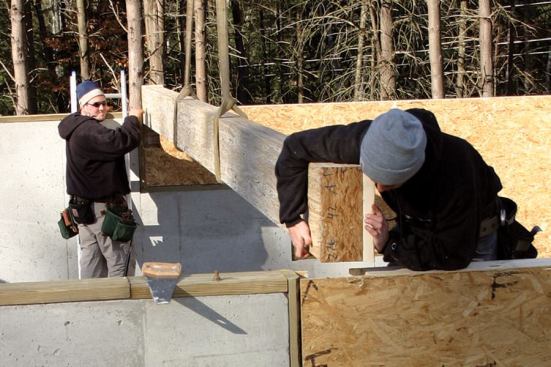 Larger and more complicated SIP floors need underfloor support. Parallam (shown) and LVL beams match up well with SIPs because of their engineered strength, limited shrinkage, and dimensional consistency
