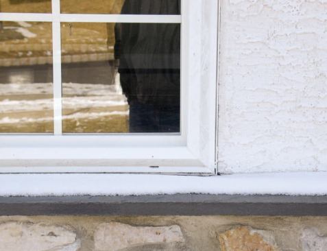 When the author investigated this home's leaky windows, he found that the stucco was tight against the window frames — an indication that no casing bead had been installed.