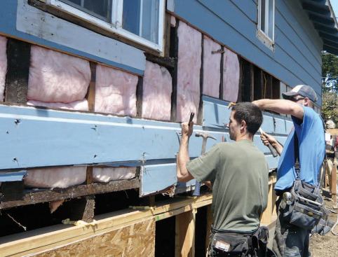 The crew removed the siding so they could access the stud bays for air-sealing and then install sheathing.
