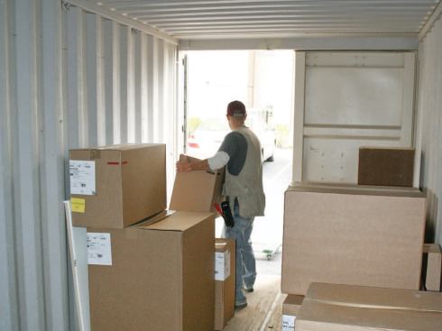 With a capacity of about 120 boxed cabinets, two storage containers weren't enough to hold all of the upper and lower cabinets needed for 50 kitchens; they had to be restocked every other week.