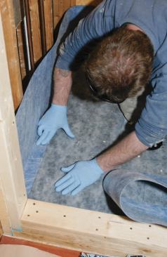 I firmly bedded the 2-inch leg into the sealant, looking for a continuous line of squeeze-out.