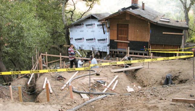 The view from the driveway, where the new garage foundation is being laid out.