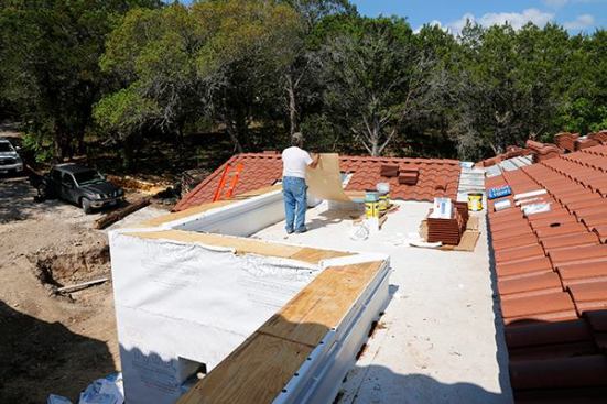 We start the cap waterproofing by stripping off any Tyvek to get to a bare substrate.