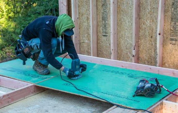 Plunge Router. It doesn't take long to sheath walls, but cutting out door and window openings can really slow you down. At various times we’ve used circular saws (too much layout), recip saws (slow; makes rough cuts), and chainsaws (dangerous; makes a terrible mess). For the past 10 years we’ve used a plunge router with a flush cut bit. It’s fast, requires no layout work, and leaves a smooth flush edge at the openings.