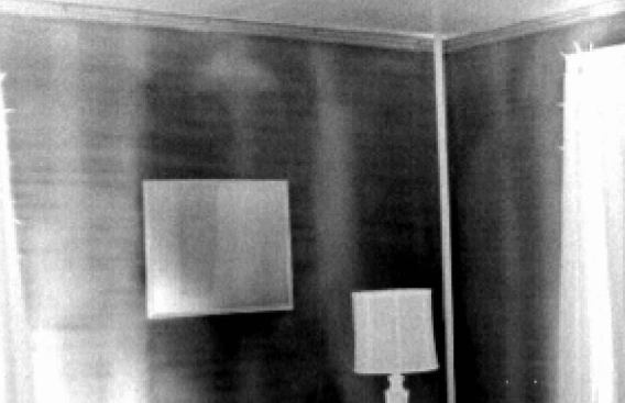 Powering up a building's hvac system can boost the delta-T enough to allow good imaging, but it can also cause uneven surface temperatures. A baseboard heating unit is responsible for the warm streaks in this grayscale image.