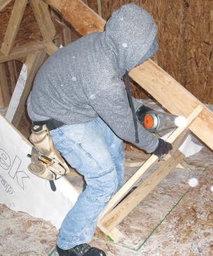 Ridge: Next we laid out the ridge board and secured it between a second pair of rafters at the back of the dormer.