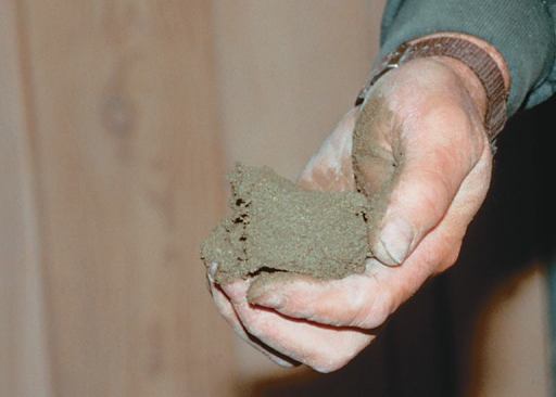 The mud mix, or "screed" -- a combination of Portland cement, sand, and water -- is mixed fairly dry, so that it holds its shape when compressed.