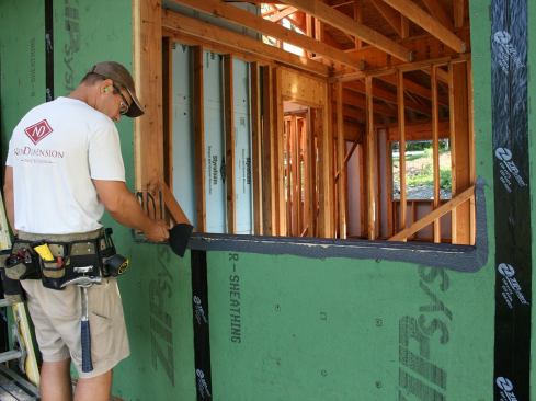 Spread the product out evenly using spatula, putty knife, or similar tool. Apply a minimum of 2 inches on to the face of the ZIP System sheathing.
