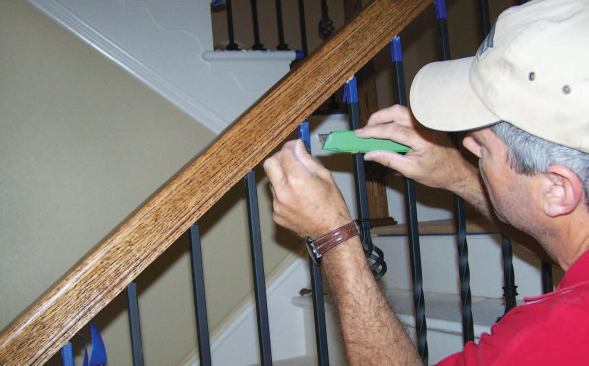When the epoxy is partially cured but not fully hardened, I carefully remove the protective masking tape from the treads, handrail, and balusters.