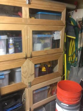 Miscellaneous items are stored in a separate cabinet near the front of the trailer. As with the other doors, these have mitered frames held together with pocket screws. The acrylic panels are secured by glazing points.