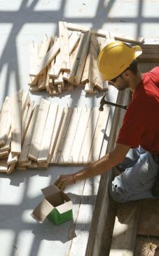 Another groundlevel worker prepares spacers and bracing material (C) and keeps the other carpenters supplied with nails and anything else they need.