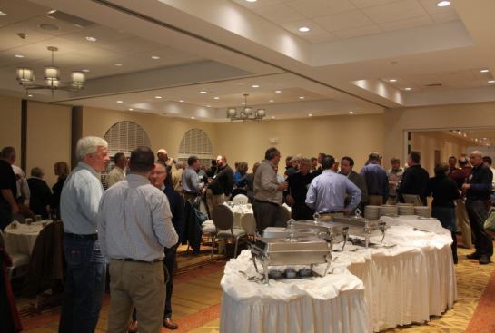 The monthly meeting starts with an hour of very active networking between the members.