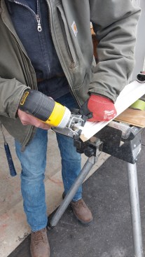 By holding a jigsaw at he opposite angle of the miter, you can make an ideal back cut. 