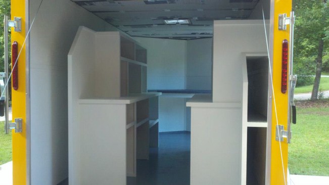 A solar-powered roof fan keeps it cooler in summer. Storage on the right can also accommodate stepladders.