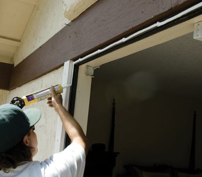 Before the window is installed, the old window frame gets a 1/2-inch-diameter continuous bead of polyurethane sealant.