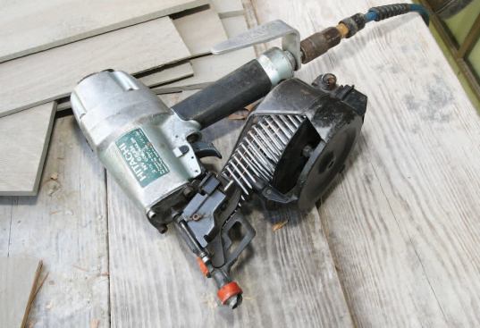 The crew also uses coil siding nailers to fasten shingles.