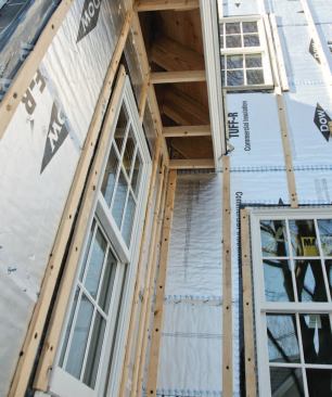 Exterior window casings were fastened over the 1x3 siding vent strapping.