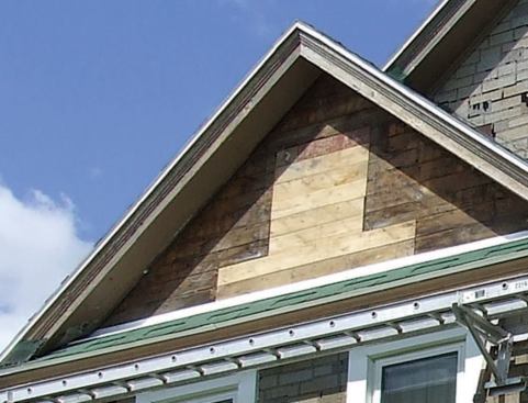 After stripping the old siding, I measured down perpendicularly from the peak to the base of the gable, and up the rake from the base flashing to the peak.