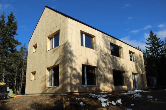 Early winter sun casts shadows on the south wall of the Blue Hill EcoCor project.
