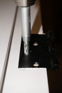 Predrilling in the exact center eliminates the problems caused by the misaligned screws that factory pre-hung doors often have.