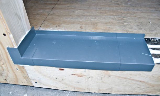A multipiece plastic door pan