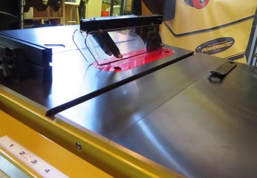 The saw has a modular guard similar to the ones found on portable models. The guard, pawls, and splitter can be removed and installed without tools. The manufacturer refers to the splitter as a riving knife – and while it performs the same function is not the same thing because it can’t be lowered for non-thru cuts.