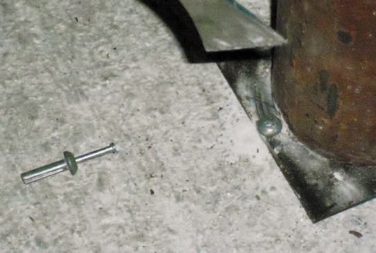 At the bottom, I install a concrete anchor to keep the base plate in place until the new slab is poured.