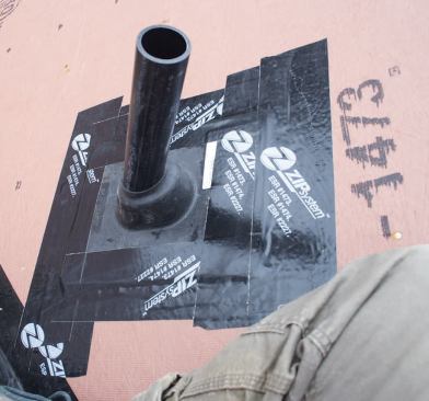 Roof penetrations are sealed with tape — which is guaranteed to remain watertight for up to 120 days — before being covered.