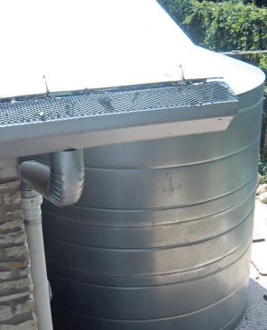 Solid debris such as leaves and twigs are kept out of the system by screening the tops of the gutters.