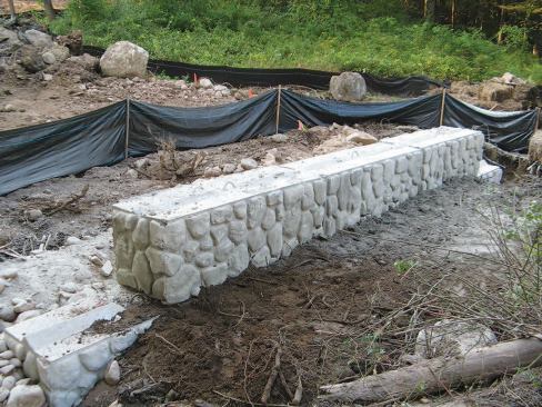 Note the silt fences--required during construction--behind the cast concrete faux-stone abutments.