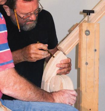Then the lower volute is fastened to the handrail with a rail bolt.