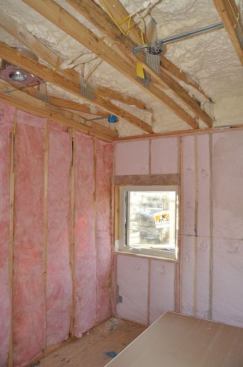 Open-cell foam was used at the roof deck, and blown fiberglass at the exterior walls. Batts were used on interior walls for sound control.