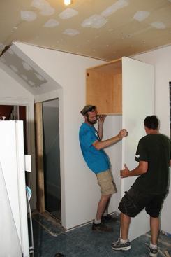 Now the cabinet can be set into place and fastened to the wall.