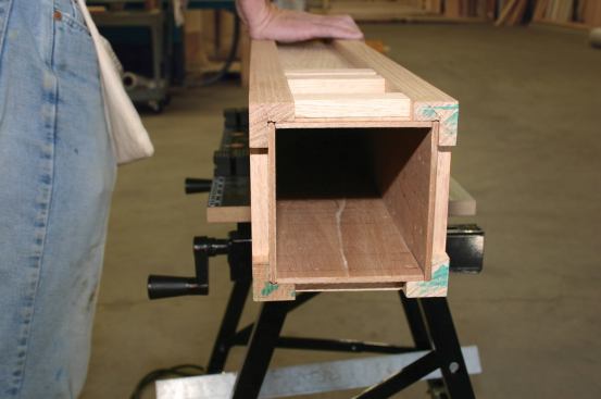 Because the 1/4-inch plywood panels are fairly flexible, the author is able to insert the fourth panel by pulling apart the two sides and springing it into place.