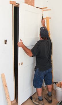 With the lever inserted about mid-door, light pressure floats the door onto the hinges.