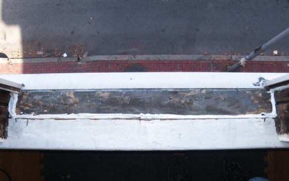 I fill the gaps at the base of each jamb and caulking between and on top of the shim screws.