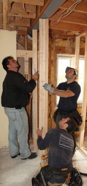 Then, using a bottle jack, they forced it up into the slot and supported it on temporary wood posts.