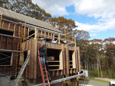 EcoCor's wall system uses wood I-joists applied to the outside face of an OSB-sheathed 2x4 stud wall, to form a cavity for dense-pack cellulose insulation. Says builder Chris Corson: "It's like wrapping the house in a puffy jacket of cellulose."