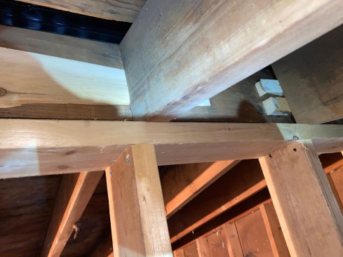 For good measure, the author shimmed any remaining gaps between the rafters and the ridge board.