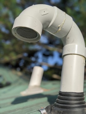 To prevent water from entering the exhaust pipe, he connects two 90-degree elbows together and attaches them to the exposed PVC stack. He keeps the outlets high enough to prevent snow from blocking them. In areas with more snowfall, they can be made higher, though in practice, the exhaust typically melts snow away from most roof vents before it can cause problems. 
