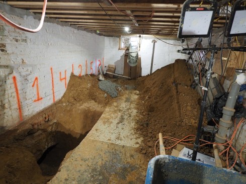 From the backyard, concrete is delivered to the basement via a chute.