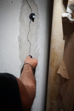 Toby sticks a port over each drilled hole.