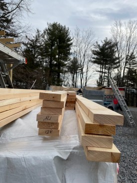 Corner boards are fashioned from 5/4 stock, with one leg of the corner assembly 1 1/8 inches narrower than the other so they show the same width on each side when installed. 