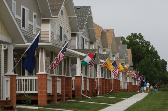 Pagés designed the interiors in this development to respond to cultural preferences of the new owners. On opening day, he placed an American flag and a flag of the new owner’s home country on the front porch.